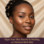 Black woman in a calm skincare setting for signs your skin barrier is healing on melanin-rich skin