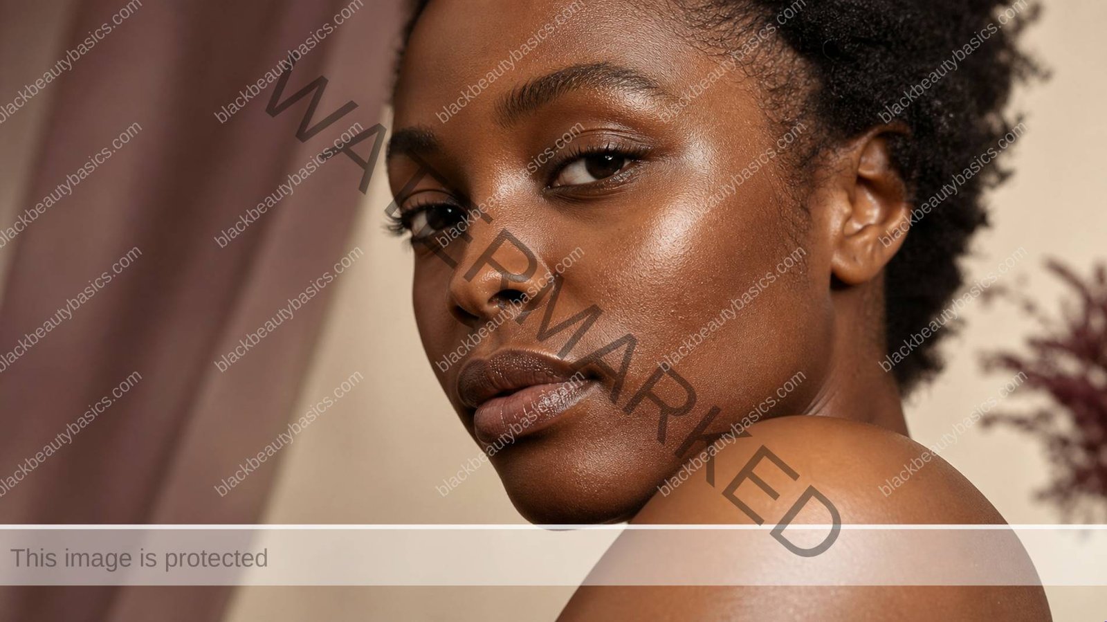 Black woman with visible natural skin texture in a soft educational beauty close-up