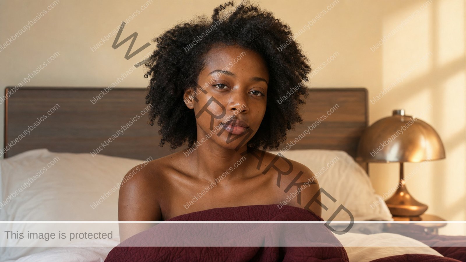 Black woman noticing morning dryness in a softly lit bedroom mirror