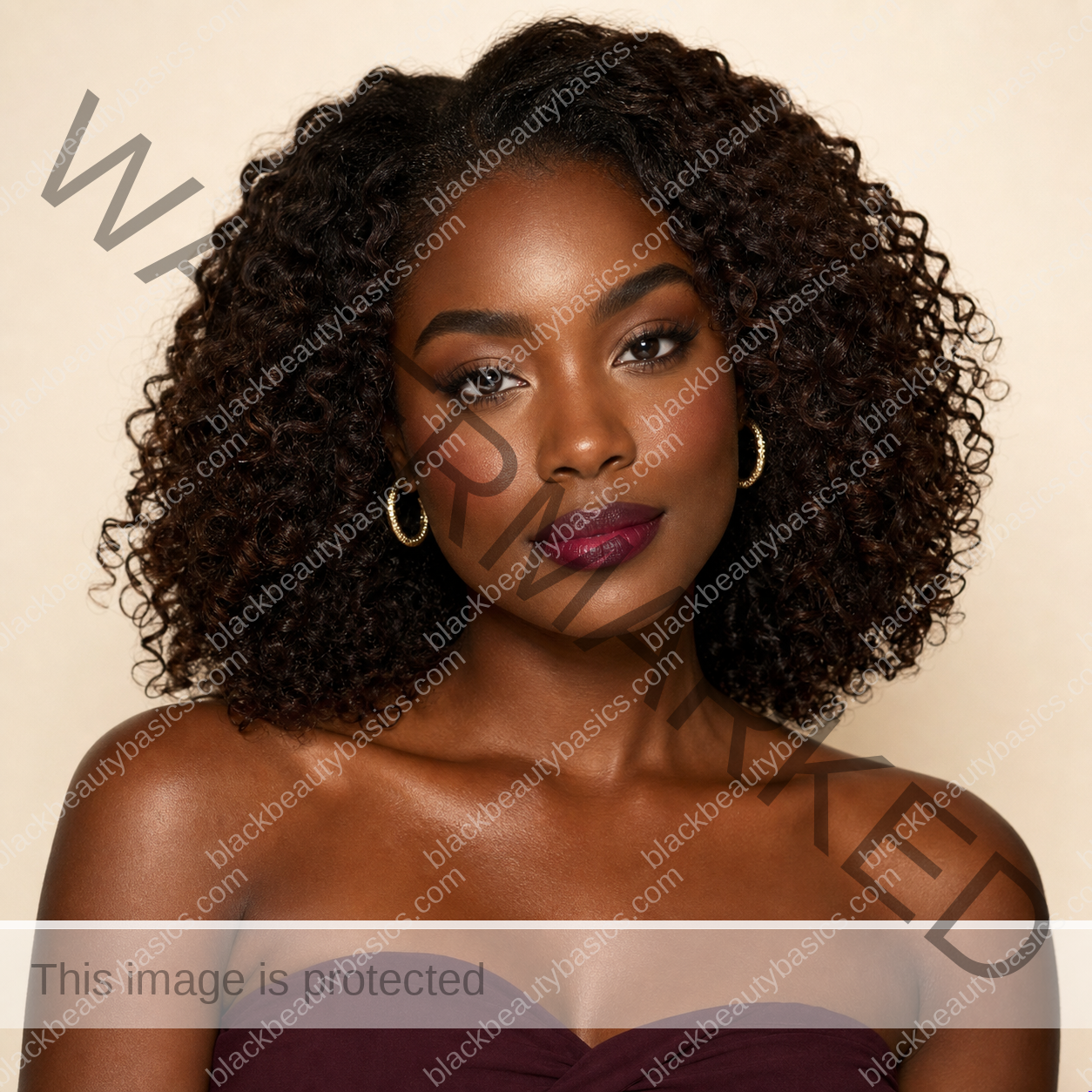Black woman with rich brown skin wearing a softly blended berry ombre lip
