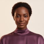 Black woman with rich brown skin in an editorial portrait for how to create a low-budget barrier repair routine