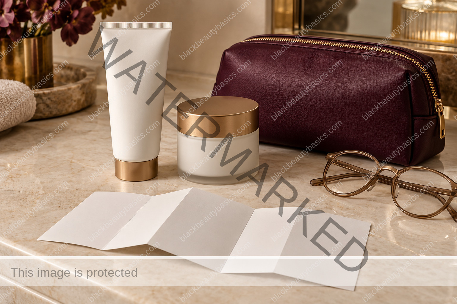 Plain skincare containers, blank leaflet, bronze glasses and plum pouch on a counter